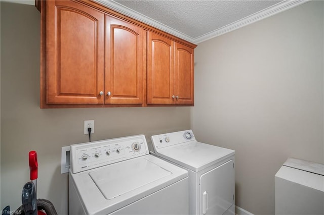 269 Country Villa Dr, Lexington, NC 27295 - washroom featuring cabinet space, washer and dryer, a textured ceiling, and crown molding