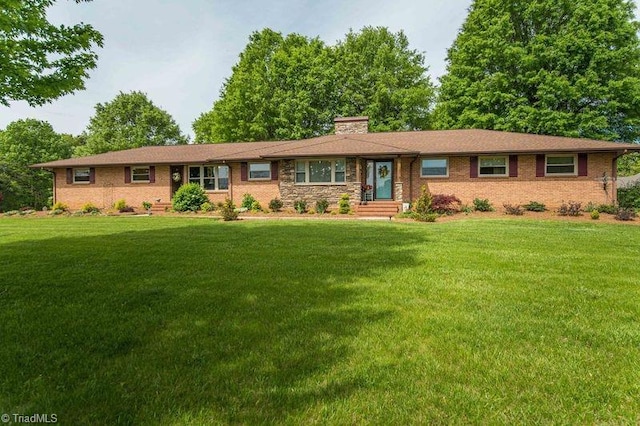 7044 Belews Creek Rd, Belews Creek, NC 27009 - ranch-style home with brick siding, a front yard, and a chimney