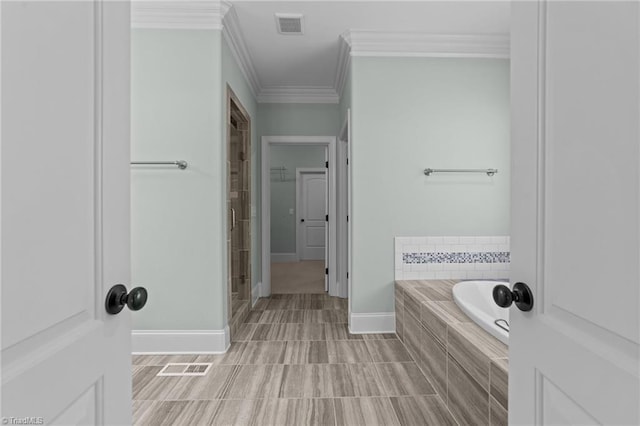 2507 Duck Club Rd, Greensboro, NC 27410 - full bath with a bath, ornamental molding, tiled shower, and tile patterned flooring