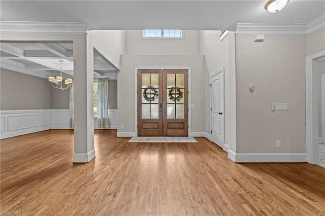 2507 Duck Club Rd, Greensboro, NC 27410 - foyer with healthy amount of natural light, a chandelier, ornamental molding, light wood finished floors, and french doors