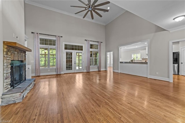 2507 Duck Club Rd, Greensboro, NC 27410 - unfurnished living room featuring ceiling fan, a fireplace, high vaulted ceiling, light wood-style flooring, and ornamental molding