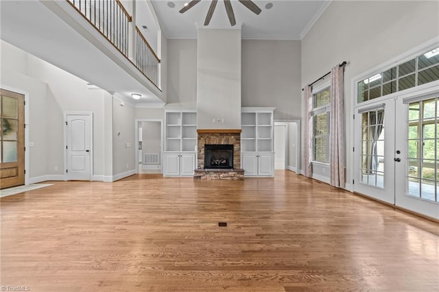 2507 Duck Club Rd, Greensboro, NC 27410 - unfurnished living room featuring a high ceiling, ceiling fan, french doors, light wood-type flooring, and crown molding