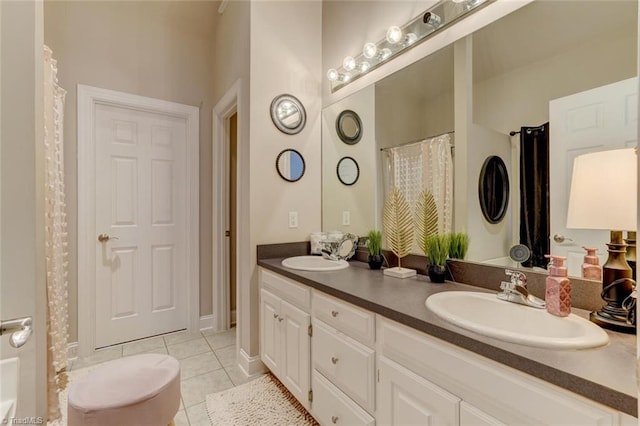 bathroom featuring tile patterned flooring and vanity