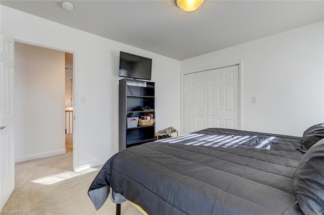 carpeted bedroom featuring a closet