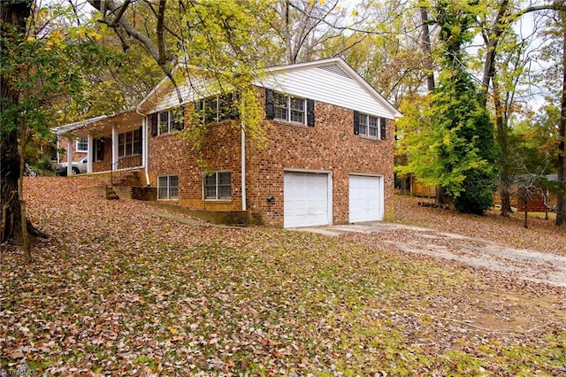 view of side of property with a garage