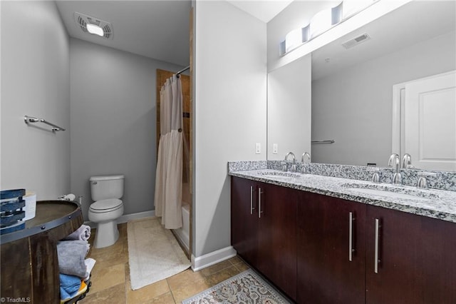 full bathroom featuring vanity, toilet, tile patterned floors, and shower / bath combo