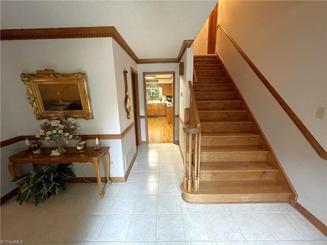 stairs featuring ornamental molding