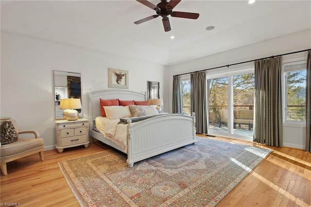 bedroom featuring ceiling fan, light hardwood / wood-style flooring, and access to outside