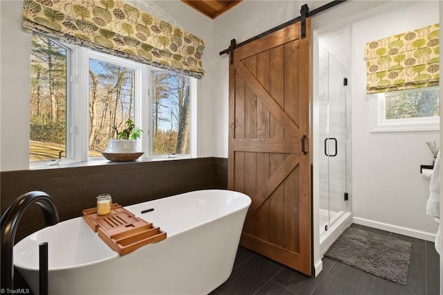 bathroom featuring plenty of natural light, tile patterned floors, and shower with separate bathtub