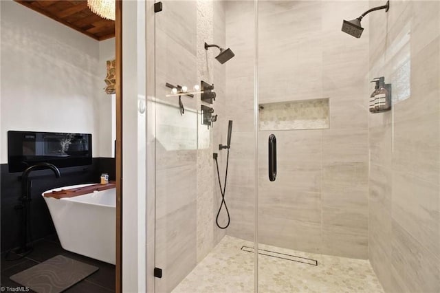 bathroom with wood ceiling and shower with separate bathtub