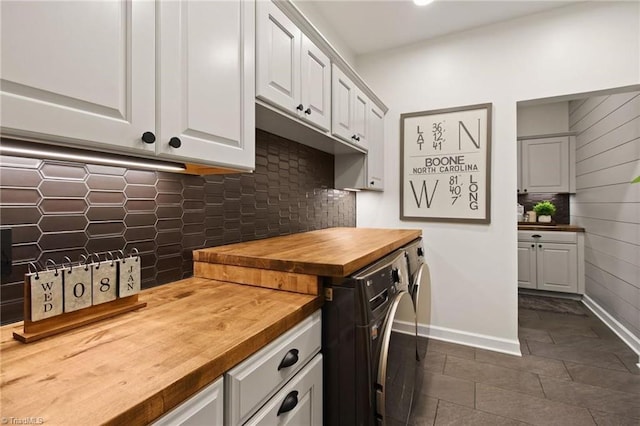 washroom featuring cabinets and independent washer and dryer