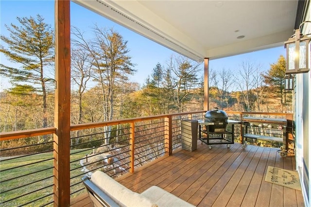 wooden terrace featuring grilling area