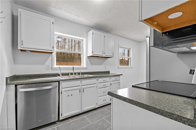 kitchen with sink, stainless steel dishwasher, white cabinets, and a textured ceiling