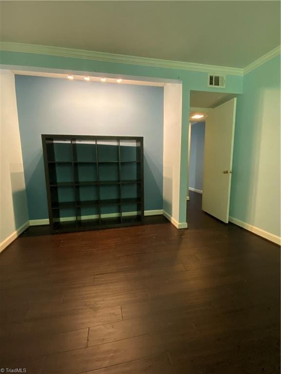 2821 Bleeker Sq Unit E, Winston-Salem, NC 27106 - empty room featuring dark wood-type flooring, ornamental molding, and baseboards