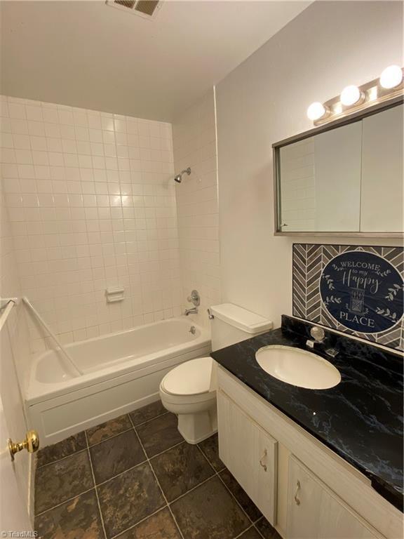 2821 Bleeker Sq Unit E, Winston-Salem, NC 27106 - full bathroom with vanity, toilet, and shower / bathtub combination