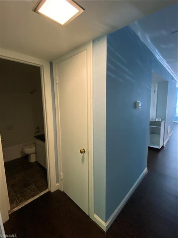 2821 Bleeker Sq Unit E, Winston-Salem, NC 27106 - corridor featuring baseboards and dark tile patterned floors