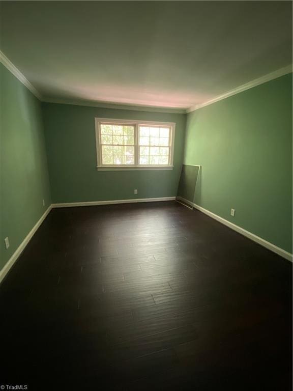 2821 Bleeker Sq Unit E, Winston-Salem, NC 27106 - unfurnished room with ornamental molding, baseboards, and dark wood-type flooring