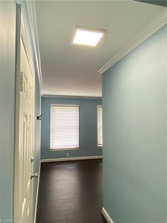 2821 Bleeker Sq Unit E, Winston-Salem, NC 27106 - spare room with ornamental molding, baseboards, and dark wood finished floors