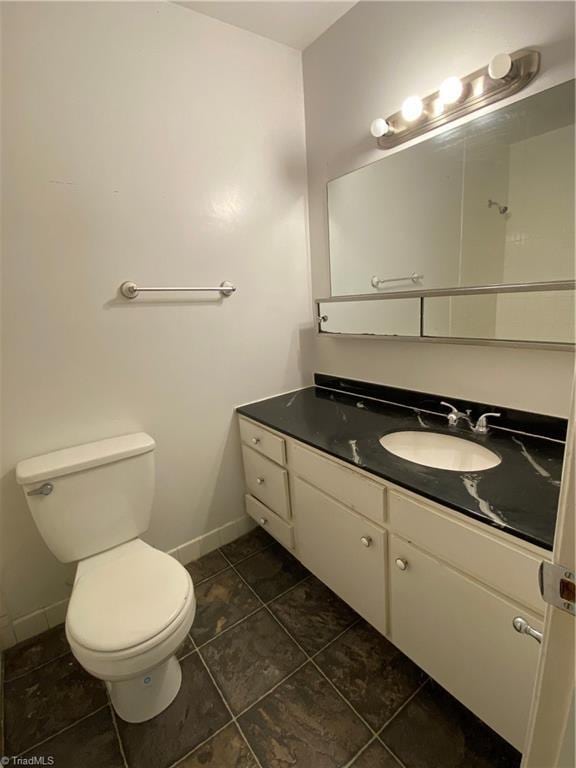 2821 Bleeker Sq Unit E, Winston-Salem, NC 27106 - bathroom featuring vanity, toilet, baseboards, and tile patterned flooring
