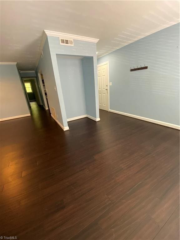 2821 Bleeker Sq Unit E, Winston-Salem, NC 27106 - unfurnished room featuring ornamental molding, baseboards, and dark wood-style floors