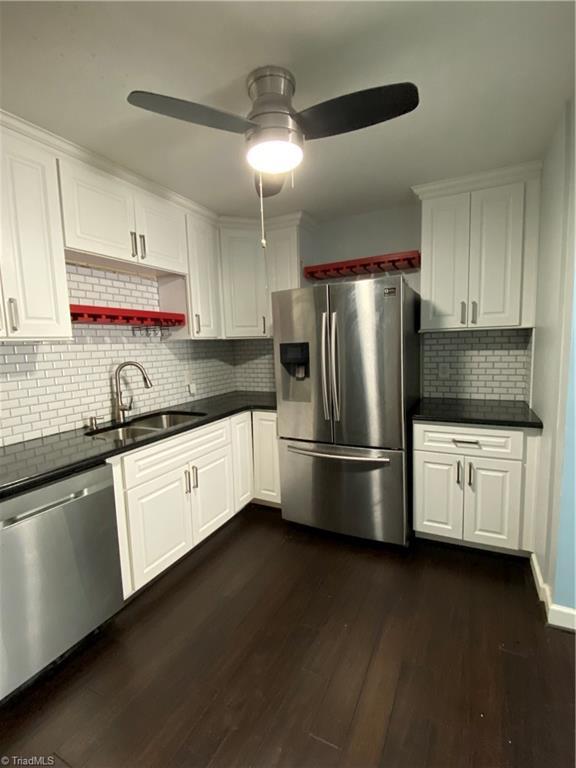 2821 Bleeker Sq Unit E, Winston-Salem, NC 27106 - kitchen with stainless steel appliances, a sink, ceiling fan, and dark countertops