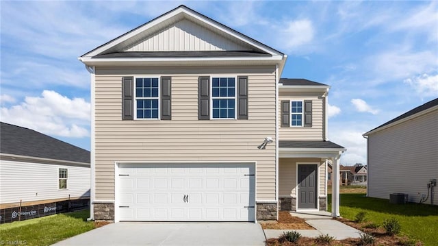 3765 Baden Rd, Winston-Salem, NC 27107 - craftsman-style house with concrete driveway, an attached garage, stone siding, and a front lawn