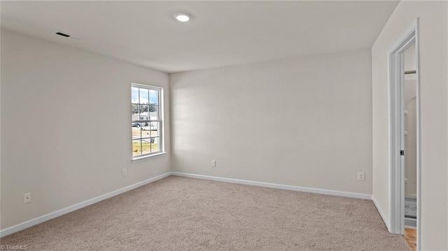 3765 Baden Rd, Winston-Salem, NC 27107 - empty room featuring light colored carpet, baseboards, and visible vents