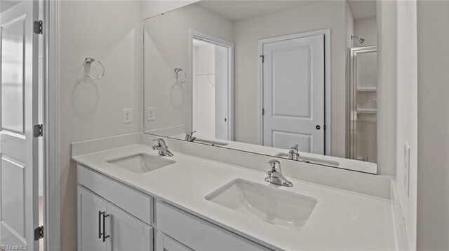 3765 Baden Rd, Winston-Salem, NC 27107 - bathroom with double vanity, a sink, and a closet