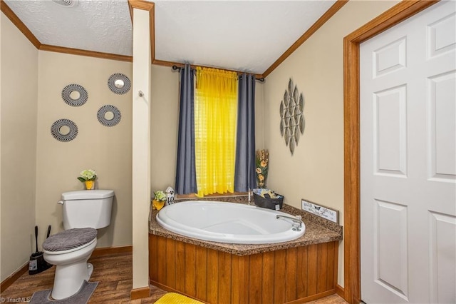 1030 Endeavour Ln, Walnut Cove, NC 27052 - bathroom featuring ornamental molding, toilet, a bath, wood finished floors, and baseboards