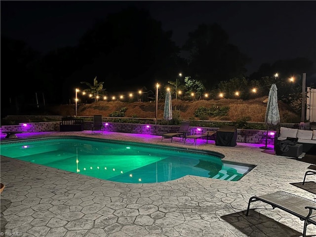 422 Manor Dr, High Point, NC 27260 - pool at night featuring a patio area