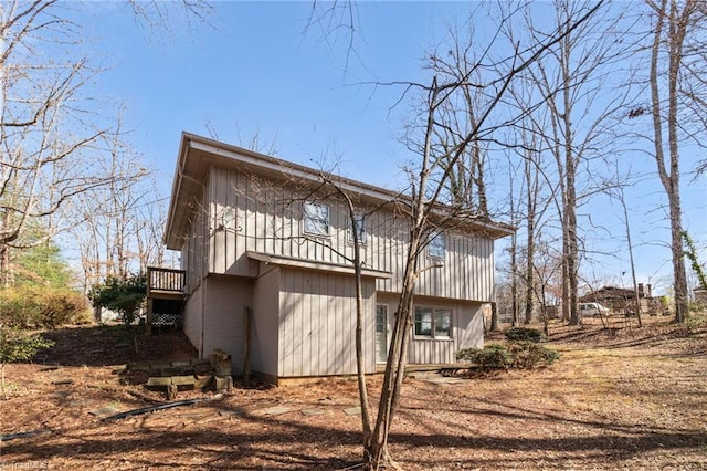 back of house featuring driveway