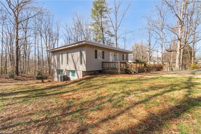 exterior space featuring a deck and a yard