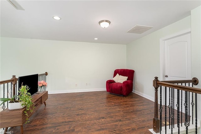 2452 Tannin Ct, High Point, NC 27265 - sitting room with wood finished floors, recessed lighting, and an upstairs landing