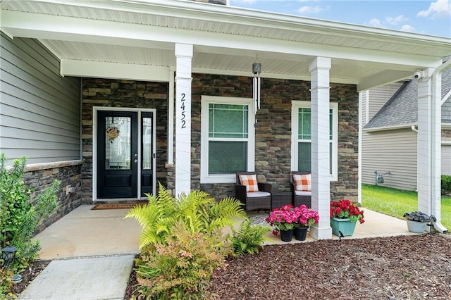 2452 Tannin Ct, High Point, NC 27265 - property entrance featuring stone siding and covered porch