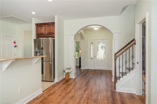 2452 Tannin Ct, High Point, NC 27265 - foyer with arched walkways, light wood finished floors, recessed lighting, and stairs