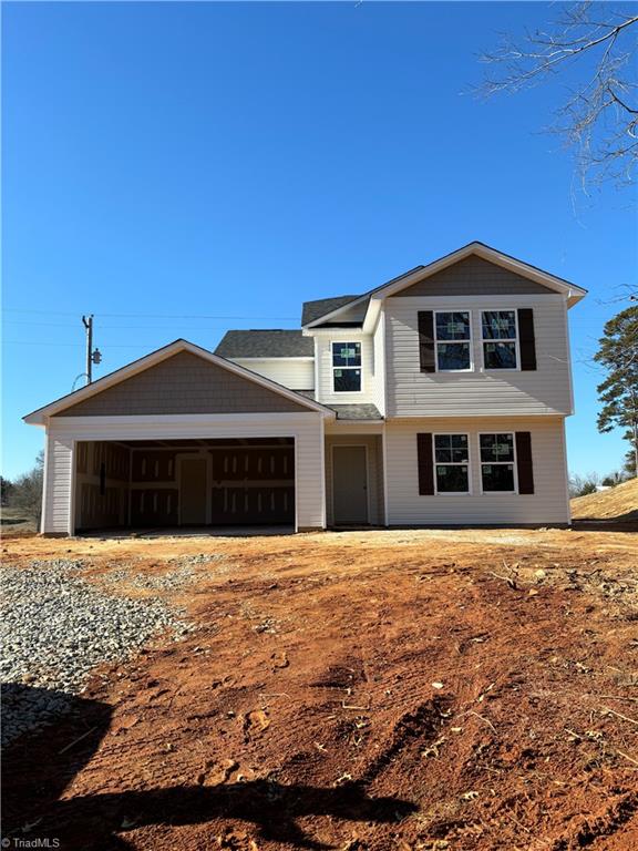 view of front of property with driveway and an attached garage