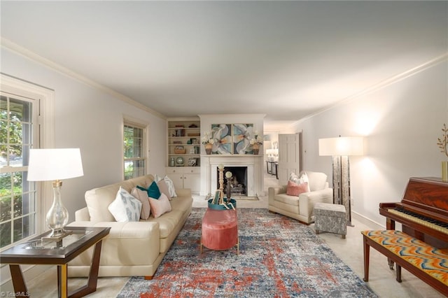 carpeted living room featuring ornamental molding and built in shelves