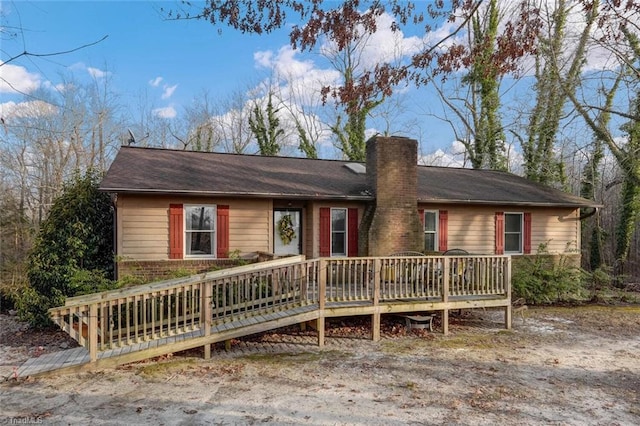 ranch-style home featuring a deck