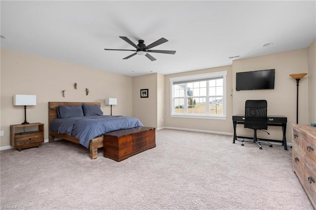 bedroom featuring light carpet and ceiling fan