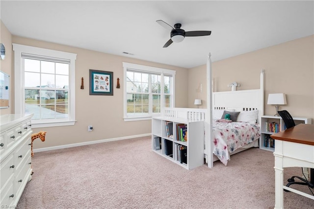 carpeted bedroom with ceiling fan