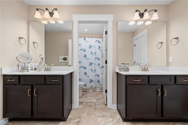 bathroom with toilet and vanity