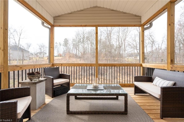 sunroom featuring lofted ceiling