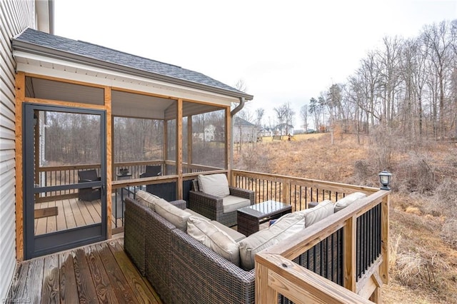 wooden terrace with an outdoor living space and a sunroom