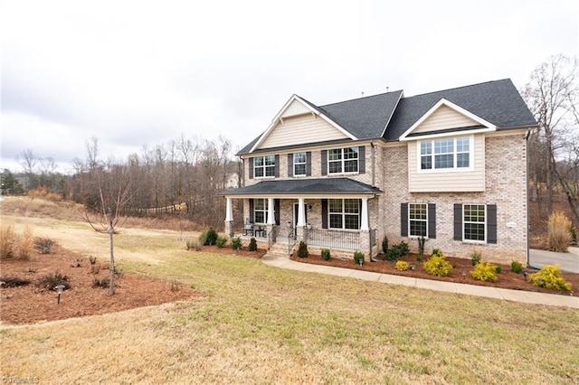 craftsman-style home featuring a front yard and a porch