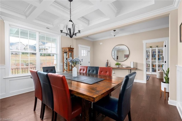 dining area with dark wood-type flooring, beam ceiling, crown molding, and a notable chandelier