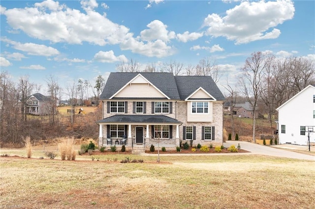 view of front of home featuring a porch and a front yard