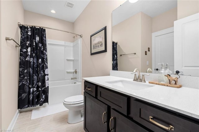 full bathroom with vanity, toilet, and shower / bath combo