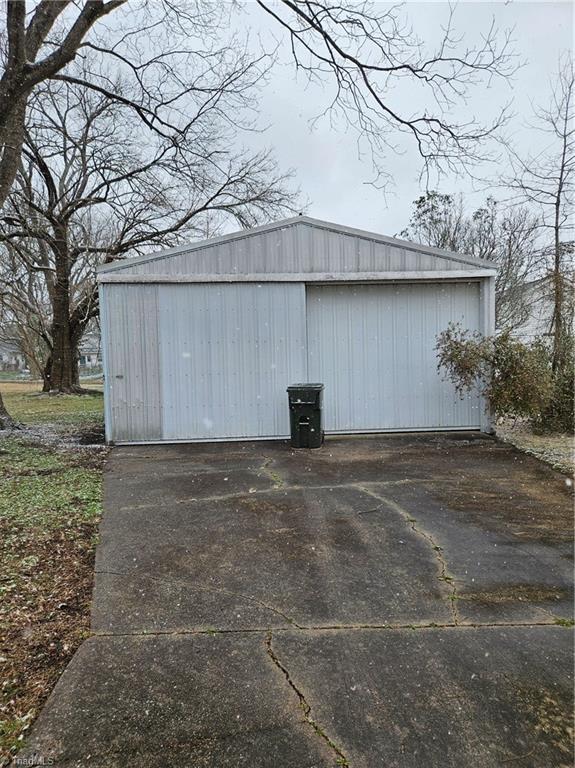 detached garage featuring driveway