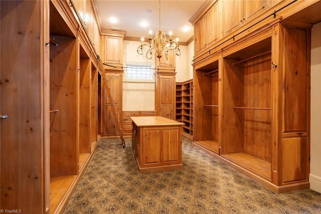 spacious closet featuring a notable chandelier