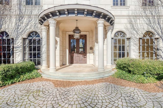 entrance to property featuring french doors